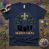Mardi Gras t-shirt design with a silhouette jazz band, fleur-de-lis, and balconies in purple, green, and gold