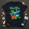 Mauritius tropical t-shirt design featuring a blue whale, palm trees, hibiscus flowers, and hummingbirds