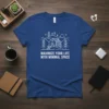 Blue t-shirt featuring a line art cabin in a forest landscape, with the text "MAXIMIZE YOUR LIFE WITH MINIMAL SPACE"