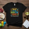 T-shirt with colorful text "May Is My Birth Day Yes, The Whole Month" and festive birthday graphics like balloons and