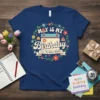 May Is My Birthday (Yes, The Whole Month) text on a navy blue t-shirt with a floral wreath and calendar