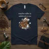 Maybe coffee is addicted to me funny quote on navy t-shirt with a cartoon coffee cup and person graphic