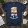 Navy t-shirt with "MAYO light SHINE FOR JESUS" text, Matthew 5:16, and "SPREAD CHRIST'S LIGHT AROUND" in a spoon graphic
