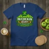 McCockin Cider St. Patrick's Day Special Edition text with green apples and leprechaun hat graphic on a navy t-shirt