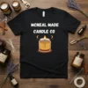 Black t-shirt with white text 'MCNEAL MADE CANDLE CO' above a graphic of a lit candle in a jar
