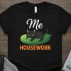Black t-shirt with "Me HOUSEWORK" text and a cartoon black cat lounging on a cucumber