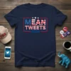 MEAN TWEETS 2024 text design with American flag elements and red, white, and blue colors on a navy t-shirt