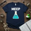 Navy blue t-shirt with the word "MEEP" above a smiling cartoon beaker filled with blue liquid and yellow bubbles