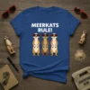 T-shirt with "MEERKATS RULE!" text and three cartoon meerkats wearing sunglasses