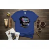 Melanin Infused Beauty text with silhouette of a woman with afro and celestial elements, on a blue t-shirt