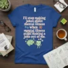 Blue t-shirt with the quote "I'll stop making jokes about mental illness when mental illness stops making a joke out