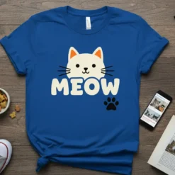 Blue t-shirt with a white cat face and the word "MEOW" in cream letters, accompanied by a black paw print