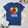 Meow I Love You T-Shirt with a black cat peeking from behind red and yellow hearts, featuring bold white text