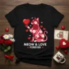 Meow & Love Forever text with a floral cat graphic holding a heart, on a black t-shirt