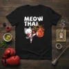 Meow Thai t-shirt with a white cat in boxing gloves performing a fiery kick, text above reads MEOW THAI