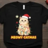 Meowy Catmas Christmas cat t-shirt with a cat wrapped in festive lights and wearing a Santa hat