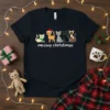 Meowy Christmas t-shirt design with five cartoon cats and the text "meowy christmas" in white