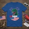 MERAWRA T-Shirt featuring a green Tyrannosaurus Rex roaring with fireworks and the American flag, in a patriotic 4th of July