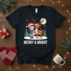 Merry & Bright Christmas T-Shirt featuring a girl with a lantern and a reindeer in a snowy scene