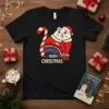 Black t-shirt with "Merry Christmas" text featuring a cartoon Santa cat holding a candy cane and a train running through