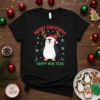 Merry Christmas Happy New Year text with a cute cartoon penguin wearing a Santa hat and antlers on a black