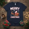 Merry Christmas T-Shirt with Santa Claus in a sleigh pulled by a reindeer, surrounded by snowflakes