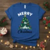 Merry Christmas t-shirt with a decorated Christmas tree featuring houses and snowflakes
