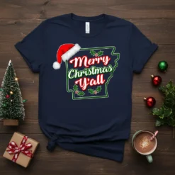 Arkansas state outline graphic with "Merry Christmas Y'all" text and Santa hat, on a navy t-shirt