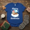 Merry Slothmas t-shirt with a cute sleeping sloth wearing a Santa hat on a cloud, surrounded by snowflakes and a