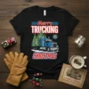 Merry Trucking Christmas t-shirt design featuring a blue semi-truck hauling Christmas trees and festive text