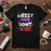 Black t-shirt with "Messy Hair Don't Care" in colorful, bold typography