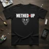 Black t-shirt with "METHED UP" text and a grinning clown face graphic