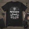 Metälsome Priest heavy metal band t-shirt design featuring gothic font, cross, gargoyles, guitars, and flames