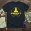 Metropolis Illinois text with a yellow circular skyline graphic on a navy blue t-shirt