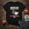 Black t-shirt with "Mexican Horror Story La Chancla" text and a lucha libre mask graphic with wings and skulls