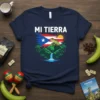 Navy t-shirt with "Mi Tierra" text, Puerto Rican flag, coqui frog, mountains, and waterfall graphic