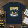 Michigan Football t-shirt design with mascot and team name, maize and blue colors