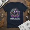 Microscope Nature's Hidden World t-shirt design with purple microscope, colorful cells, leaves, and DNA helix graphic