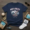 Navy blue t-shirt with "MID & SALTY" text, featuring a cartoon shark, crossed baseball bats, anchor, and waves graphic