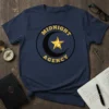 Navy blue t-shirt with the Midnight Agency circular logo in gold and black, featuring a star and crescent moon
