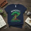 Mindset Growth t-shirt design with a tree and ladder, featuring white and green text and graphics