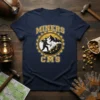 Miners CMS t-shirt design featuring a miner with pickaxe inside a gear graphic, mountains, and text MINERS CMS