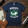 Minnesota Deer Hunting t-shirt design with a standing deer, pine trees, and water