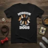 Black t-shirt with white text "MISSION PET ALL THE DOGS" and a circle of cartoon dogs