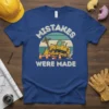 Blue t-shirt with "Mistakes Were Made" text, a yellow bulldozer, and traffic cones graphic
