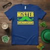 Blue t-shirt with yellow text "MISTER SHENANIGANS" and a green mustache graphic, featuring St. Patrick's Day clover elements