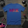 Blue t-shirt with "MKK" in gradient pink to orange, middle K features a pattern of smaller "MKK" letters