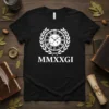 Black t-shirt with white Roman numeral clock design and "MMXXGI" text below, featuring a laurel wreath