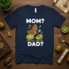 Mom? Dad? text with a cartoon kiwi bird detective examining kiwi fruit on a navy blue t-shirt