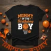 Mommy Of The Birthday Boy text with basketball graphic on black t-shirt, perfect for a basketball mom